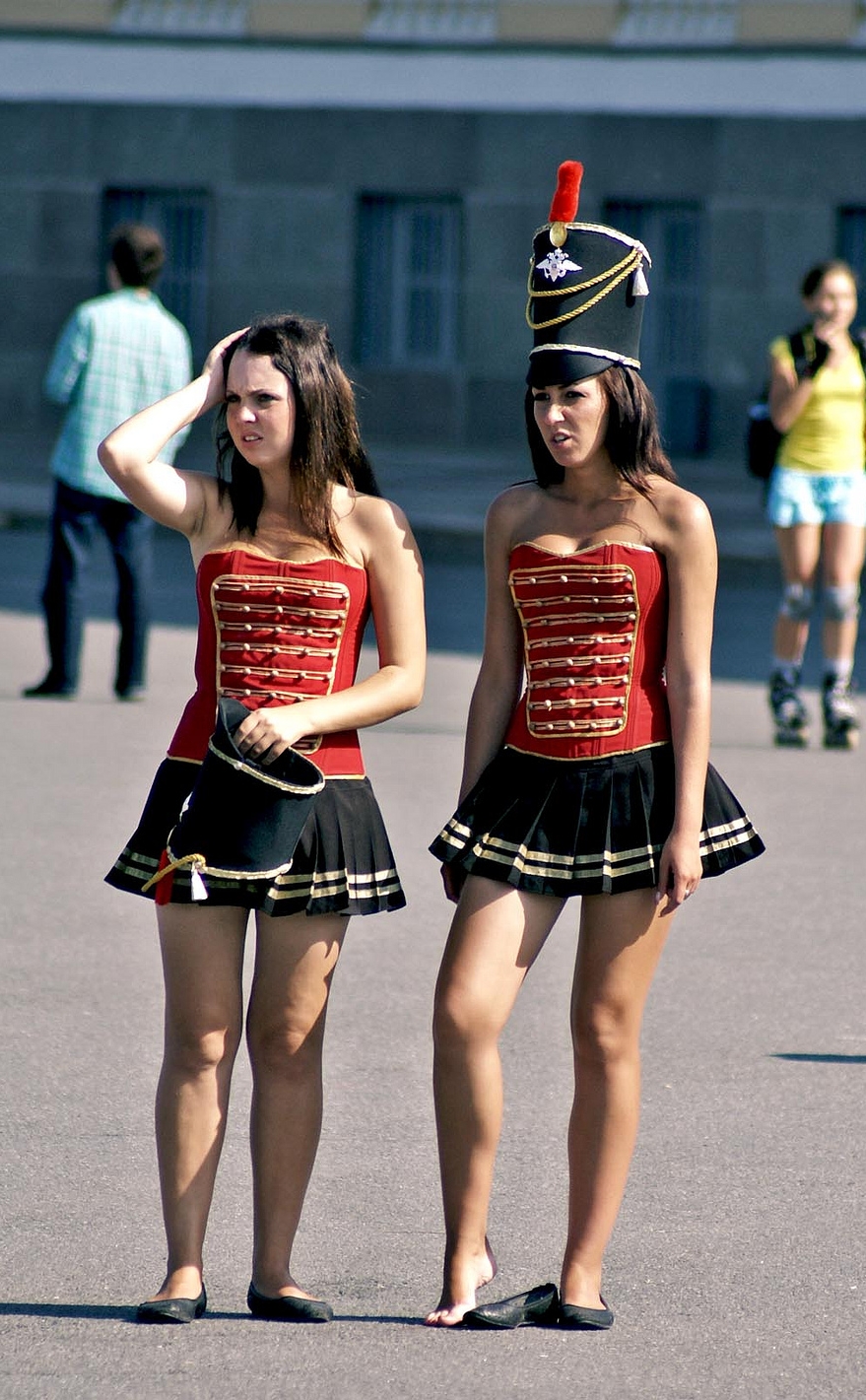 Two Brunette Majorettes with Bare Legs wearing Black Ballerinas